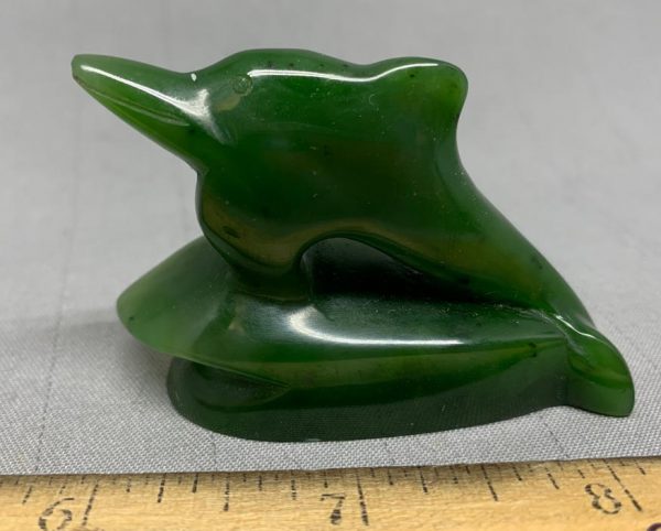 Dolphin carving by Peter Cleghorn - Alexandra, New Zealand 2.16 oz. 61g - 2.25" x 1.625" x .875"   Singed, high quality carving and greenstone nephrite jade from New Zealand, fantastic lines on this jumping dolphin riding the rest of a wave.