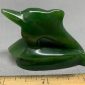 Dolphin carving by Peter Cleghorn - Alexandra, New Zealand 2.16 oz. 61g - 2.25" x 1.625" x .875"   Singed, high quality carving and greenstone nephrite jade from New Zealand, fantastic lines on this jumping dolphin riding the rest of a wave.