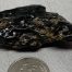 Dark Emerald Cinder nugget of Wyoming nephrite jade with crystal pockets