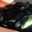 Dark Emerald Cinder nugget of Wyoming nephrite jade with crystal pockets
