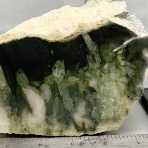 Wyoming dark olive nephrite jade with quartz crystals in cut block NQ-2
