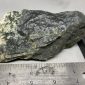 Wyoming dark olive nephrite jade with quartz crystals wind slick